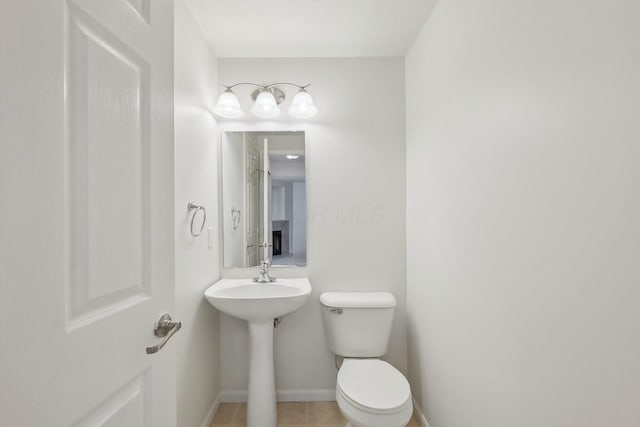 1143 Green Knoll Dr, Westerville, OH 43081 - half bathroom featuring baseboards, toilet, tile patterned flooring, and a sink