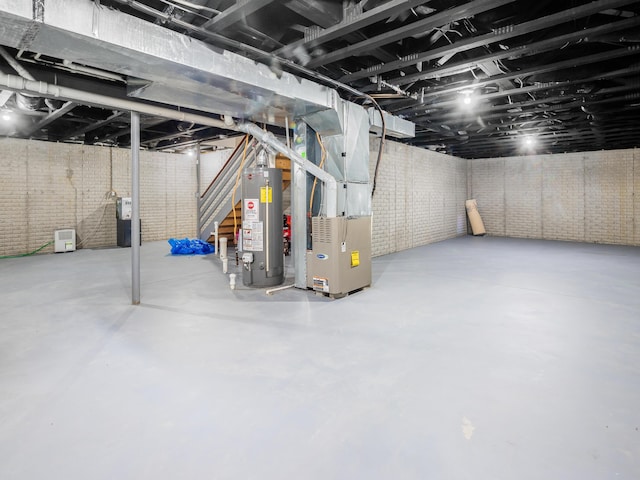 unfinished below grade area featuring gas water heater, heating unit, and stairs