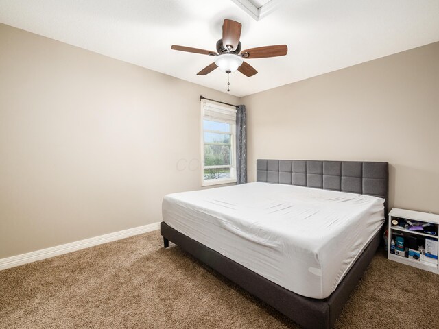 bedroom featuring carpet floors, baseboards, and a ceiling fan