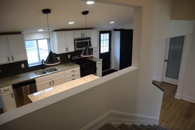 16786 Main St, Williamsport, OH 43164 - kitchen featuring appliances with stainless steel finishes, healthy amount of natural light, white cabinets, and recessed lighting