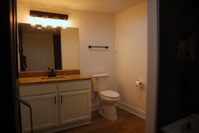 16786 Main St, Williamsport, OH 43164 - bathroom with vanity and wood finished floors