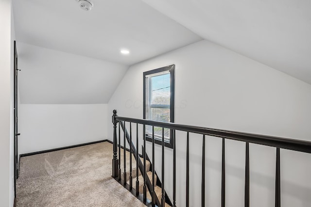 bonus room with carpet, baseboards, and vaulted ceiling