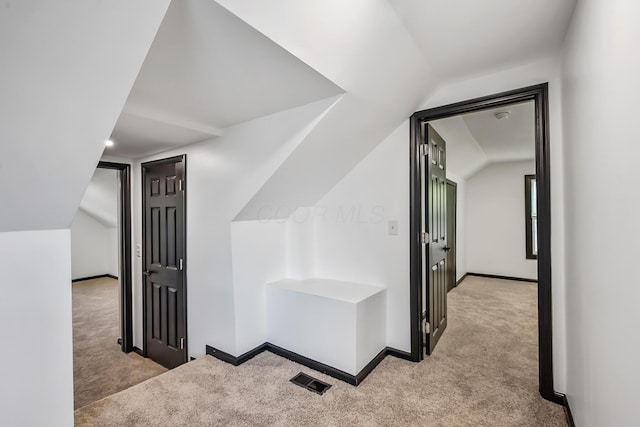 bonus room with carpet flooring, baseboards, and lofted ceiling