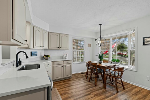 508 Straiton Sq, Westerville, OH 43082 - kitchen featuring a sink, light countertops, a notable chandelier, and dark wood finished floors