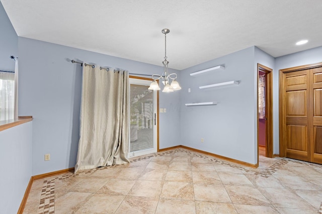2816 Quail Run Ct, Mansfield, OH 44904 - unfurnished dining area with a chandelier and baseboards