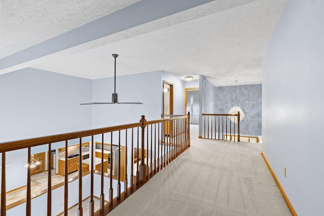 2816 Quail Run Ct, Mansfield, OH 44904 - hall featuring carpet, an upstairs landing, and a textured ceiling