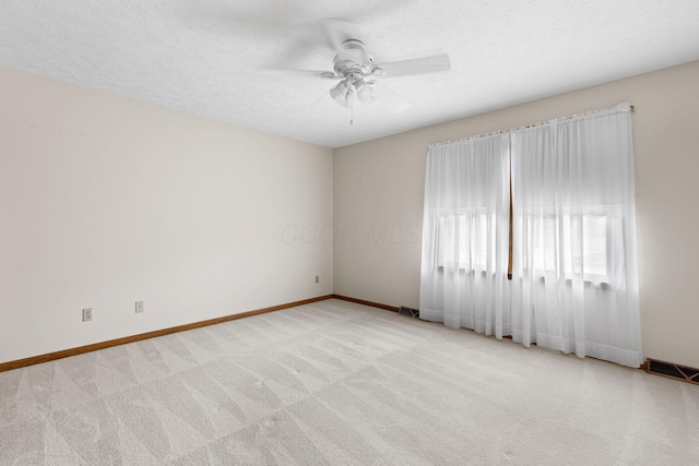 2816 Quail Run Ct, Mansfield, OH 44904 - unfurnished room featuring ceiling fan, light colored carpet, and a textured ceiling