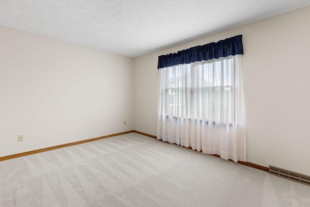 2816 Quail Run Ct, Mansfield, OH 44904 - carpeted spare room featuring baseboards and a textured ceiling