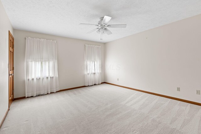 2816 Quail Run Ct, Mansfield, OH 44904 - unfurnished room with carpet floors, a ceiling fan, and a textured ceiling