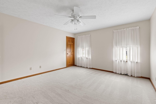 2816 Quail Run Ct, Mansfield, OH 44904 - spare room featuring light colored carpet, ceiling fan, and a textured ceiling