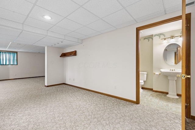 2816 Quail Run Ct, Mansfield, OH 44904 - below grade area with carpet flooring and a paneled ceiling