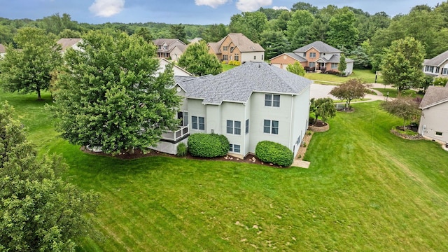 2816 Quail Run Ct, Mansfield, OH 44904 - rear view of property featuring a yard, a residential view, and roof with shingles