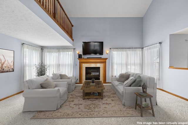 2816 Quail Run Ct, Mansfield, OH 44904 - living area with carpet, a fireplace, and a towering ceiling