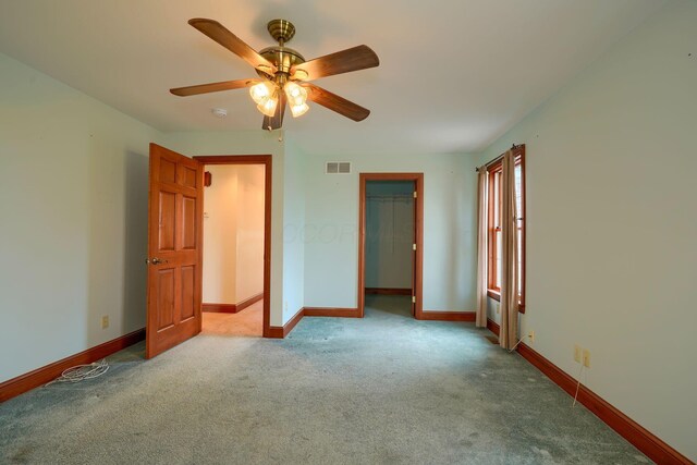 2085 US Highway 62 NE, Washington Court House, OH 43160 - unfurnished bedroom with a closet, carpet flooring, visible vents, baseboards, and ceiling fan