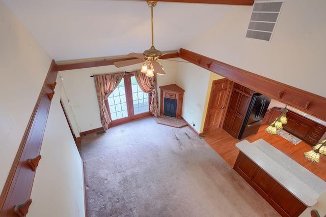 2085 US Highway 62 NE, Washington Court House, OH 43160 - unfurnished living room with baseboards, lofted ceiling, ceiling fan, and light carpet