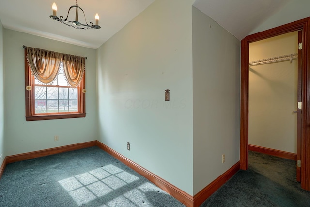 2085 US Highway 62 NE, Washington Court House, OH 43160 - carpeted spare room with baseboards, vaulted ceiling, and a notable chandelier