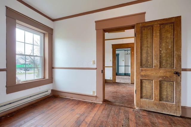 2085 US Highway 62 NE, Washington Court House, OH 43160 - unfurnished room featuring hardwood / wood-style floors, ornamental molding, and a baseboard heating unit
