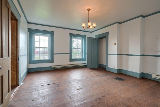 2085 US Highway 62 NE, Washington Court House, OH 43160 - spare room featuring a notable chandelier, crown molding, hardwood / wood-style flooring, baseboards, and a baseboard heating unit