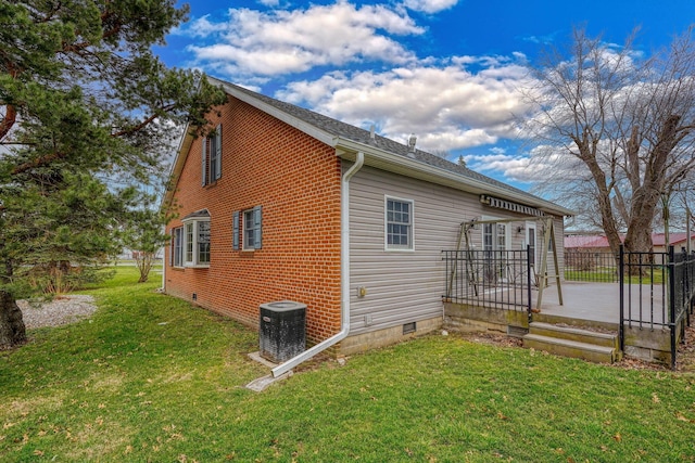 2085 US Highway 62 NE, Washington Court House, OH 43160 - view of property exterior with a lawn, central air condition unit, and crawl space