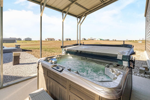 view of patio / terrace featuring a hot tub