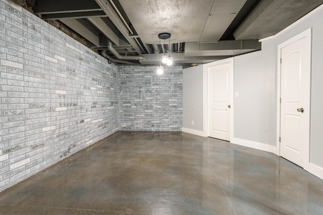 finished below grade area with brick wall