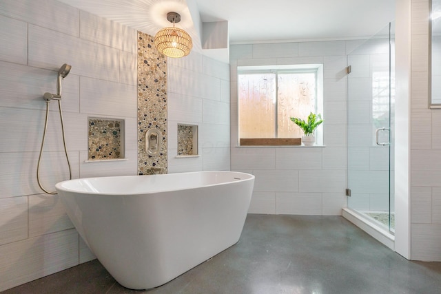 full bath with a freestanding tub, a stall shower, tile walls, and finished concrete floors