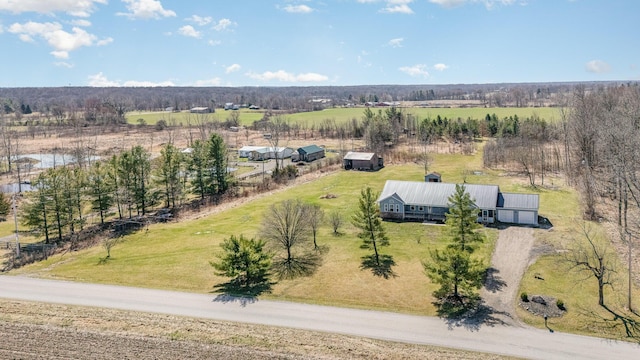 birds eye view of property with a rural view
