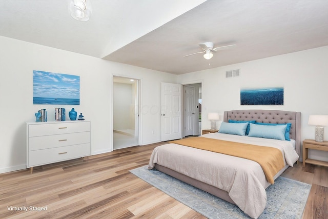 bedroom featuring baseboards, visible vents, and light wood-type flooring