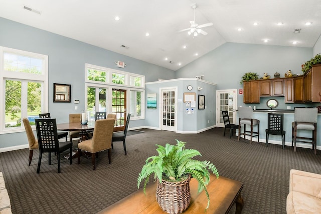 dining area featuring high vaulted ceiling, a ceiling fan, visible vents, and plenty of natural light