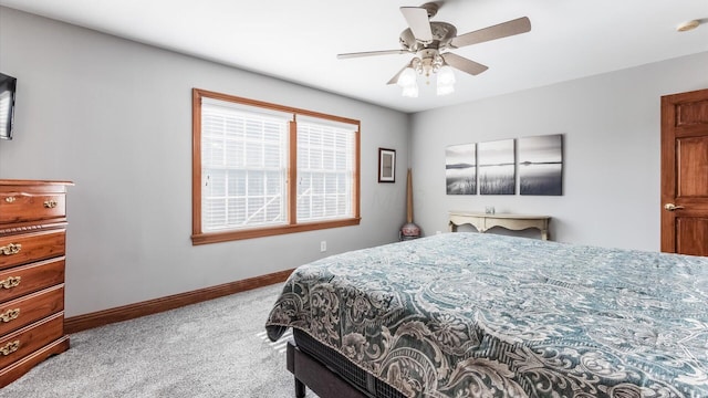 bedroom with baseboards, carpet flooring, and a ceiling fan