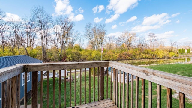 wooden deck with a lawn