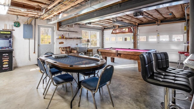 recreation room featuring concrete flooring, electric panel, and billiards