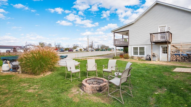 view of yard with an outdoor fire pit