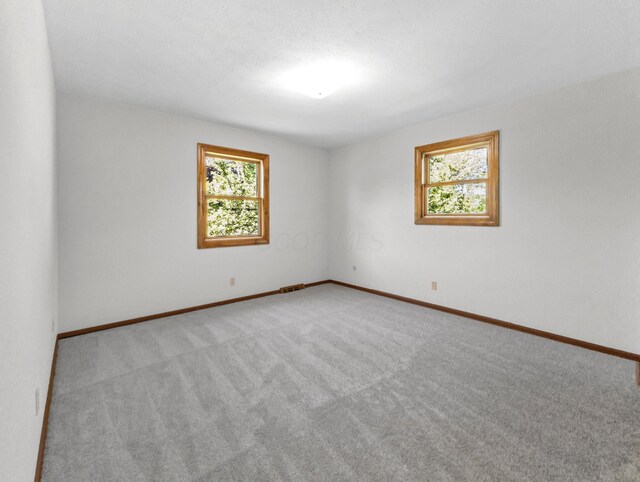 1330 Darcann Dr, Columbus, OH 43220 - carpeted empty room featuring baseboards