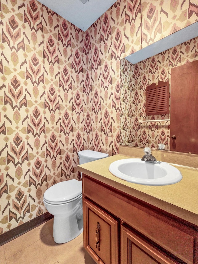 1330 Darcann Dr, Columbus, OH 43220 - half bathroom featuring wallpapered walls, toilet, vanity, and tile patterned flooring
