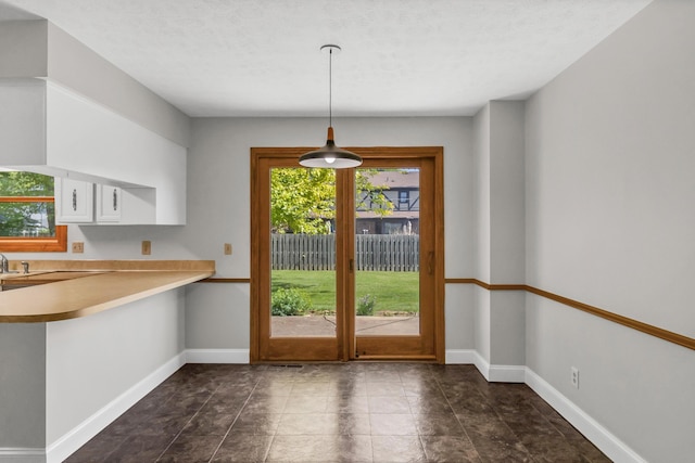 1330 Darcann Dr, Columbus, OH 43220 - unfurnished dining area with baseboards and french doors