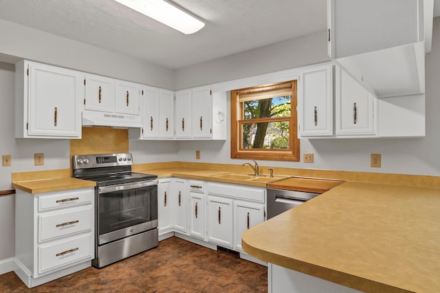 1330 Darcann Dr, Columbus, OH 43220 - kitchen featuring stainless steel appliances, under cabinet range hood, a sink, and white cabinetry