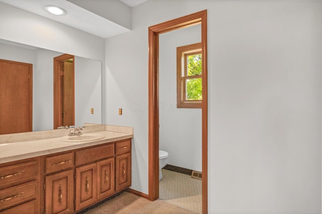 1330 Darcann Dr, Columbus, OH 43220 - bathroom featuring vanity, toilet, and baseboards