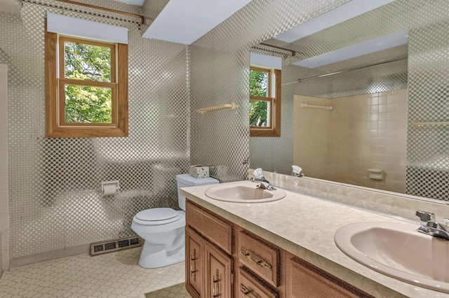 1330 Darcann Dr, Columbus, OH 43220 - full bathroom with toilet, tiled shower, and double vanity