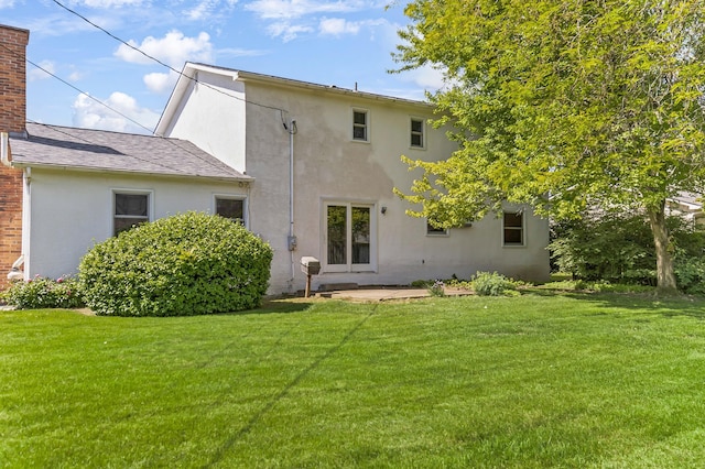 1330 Darcann Dr, Columbus, OH 43220 - back of property featuring a lawn and stucco siding