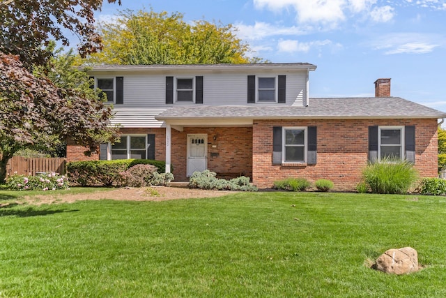 1330 Darcann Dr, Columbus, OH 43220 - traditional-style house with brick siding, a chimney, and roof with shingles