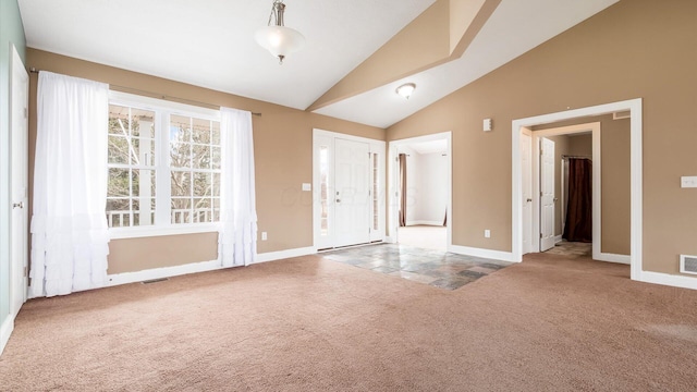 interior space featuring baseboards, vaulted ceiling, visible vents, and carpet flooring