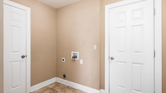 washroom with electric dryer hookup, laundry area, light tile patterned floors, baseboards, and hookup for a washing machine