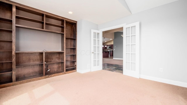 interior space featuring baseboards, french doors, recessed lighting, and carpet
