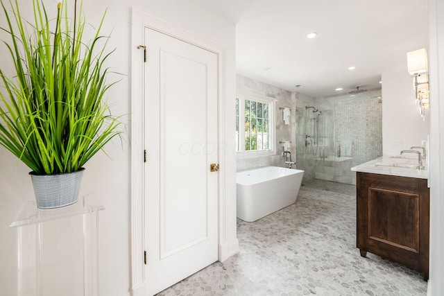2252 Club Rd, Upper Arlington, OH 43221 - bathroom with recessed lighting, a freestanding tub, vanity, and a stall shower