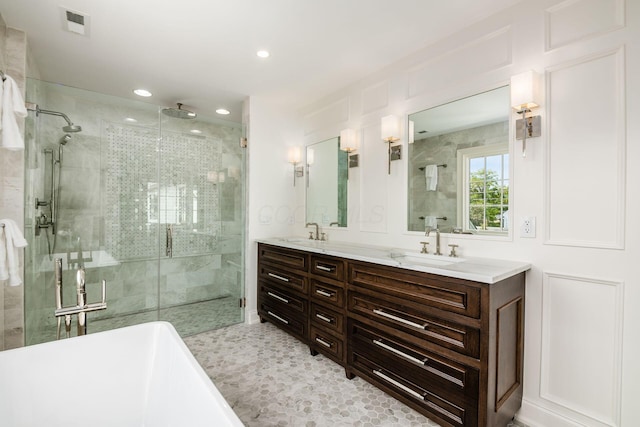 2252 Club Rd, Upper Arlington, OH 43221 - bathroom featuring recessed lighting, a shower stall, double vanity, visible vents, and a sink