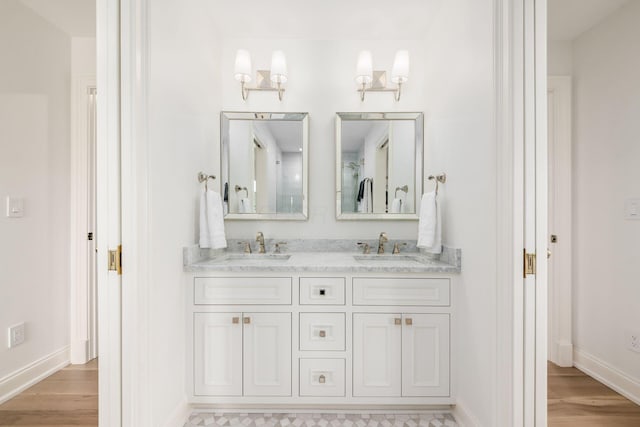 2252 Club Rd, Upper Arlington, OH 43221 - full bath with baseboards, wood finished floors, and a sink