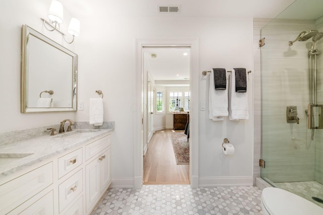 2252 Club Rd, Upper Arlington, OH 43221 - full bath with a sink, double vanity, baseboards, visible vents, and a shower stall