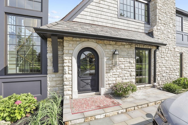 2252 Club Rd, Upper Arlington, OH 43221 - property entrance featuring roof with shingles and stone siding