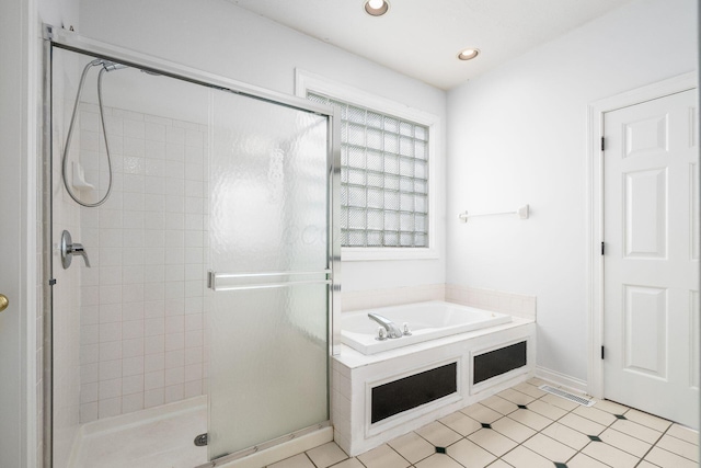 full bath with a stall shower, a garden tub, and recessed lighting